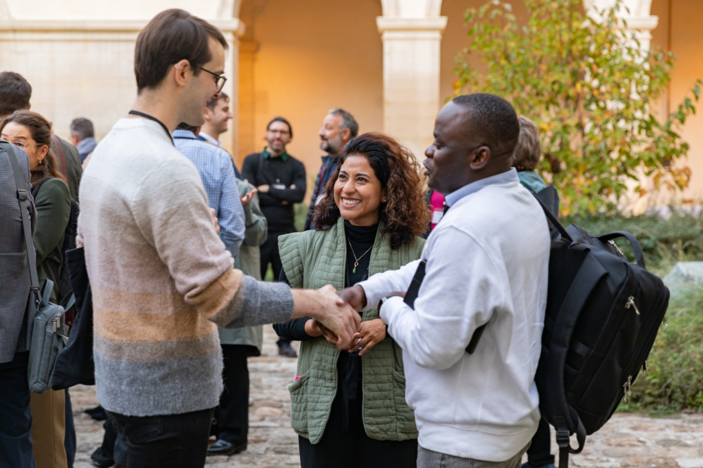 Attendees gather at a reception to close out day one of the event